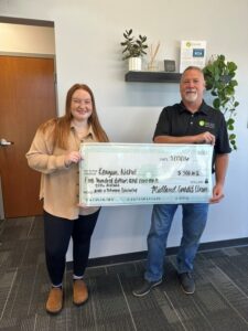 Reagan Nichol, $500 continuing education scholarship winner with CEO Randy Hass