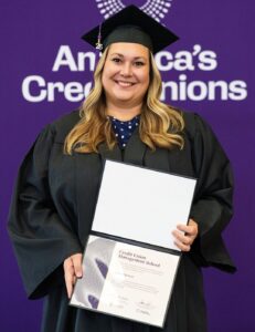 Audrey poses with her CCUE degree